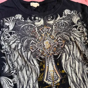 Y2K Goth Grunge Emo Punk Cross Wings Mcbling Rhinestone Black graphic fitted tee tshirt top blouse shirt short sleeve #Morbid whimsygoth #cyber #gorpcore #subversive #whimsigoth streetwear 2000s Sz S - measurement in pics 95% Cotton 5% Spandex thumbnail 2