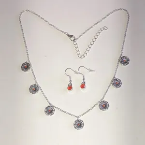 Silver Tone Floral Disc Necklace & Orange Accent Earrings Set thumbnail 2