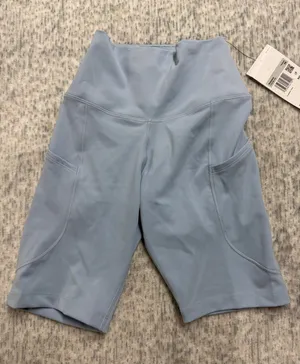 Nike One Womens High Rise 8 Inch Biker Shorts Light Blue FZ6758-440 XS‎ thumbnail 1
