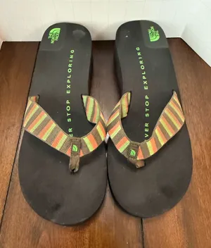 The North Face Size 8 Black Flip Flops with Green, Orange, and Brown Straps thumbnail 1