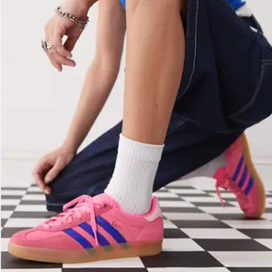 adidas Originals Gazelle Indoor sneakers in bright pink and blue thumbnail 1