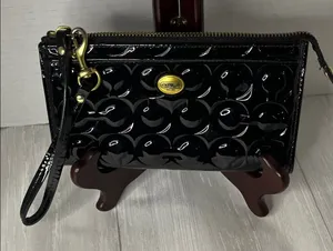Coach Black Patent Leather Wristlet with Gold Accents thumbnail 1