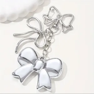 Silver Bow Dangle Earrings Double Ribbon Statement Coquette Chic NWT thumbnail 2