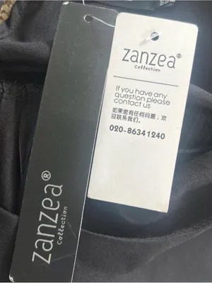 Zanzea Collection black blouse with ruffled sleeves and a flowy silhouette thumbnail 3