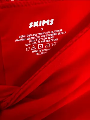 SKIMS Off-Shoulder Long Sleeve Bodysuit Romper in Ruby thumbnail 6