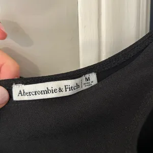 NWOT Abercrombie & Fitch Black Asymmetrical Cutout Black Tank Top thumbnail 4