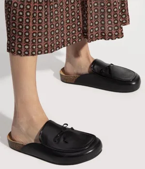 Tory Burch Leather Bow Mules in Black thumbnail 1