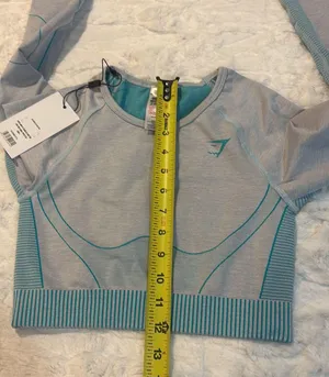 Gymshark Women's Teal and Gray Long Sleeve Crop Top Size Small . Stylish long sleeve crop top by Gymshark. Features a sleek teal and gray design. Perfect for workouts.. NWT thumbnail 8