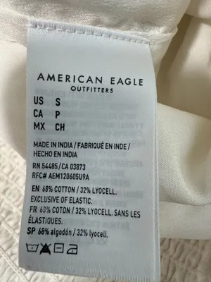 American Eagle cream romper with a tassel tie thumbnail 7