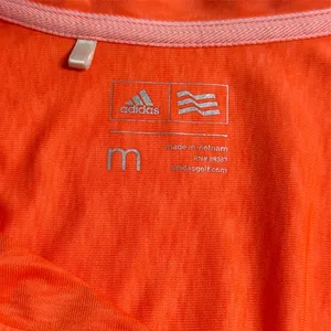 Women’s Orange Adidas Golf Polo Size Medium EUC thumbnail 3