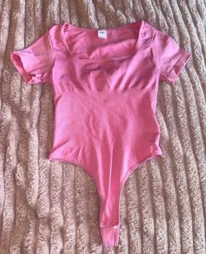 Women’s Pink Short-Sleeve One-Piece Bodysuit thumbnail 1