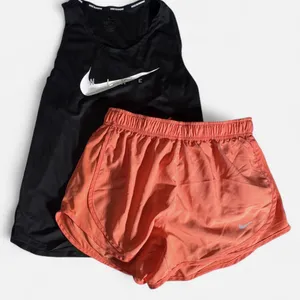 Nike dri fit running bundle -women’s size small pink shorts & black tank thumbnail 1