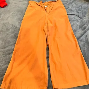 The Comfy Boutique burnt orange flared pants Size small Stretchy/ super comfy Color is like a burnt orange/brown thumbnail 1