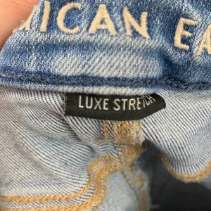 American Eagle Luxe Stretch Hi-Rise Distressed/Ripped Light Wash Jegging Jeans thumbnail 3