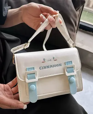 Cinnamon Small Crossbody Bag in White with Light Blue Accents thumbnail 1
