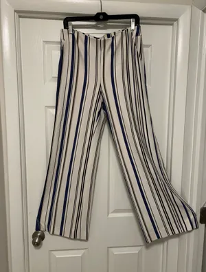 CHICO’S Stylish wide-leg pants in a navy and white striped pattern. Lightweight, flowy fabric for all-day comfort. Versatile design that dresses up or down. Easy to pair with tops and sandals. thumbnail 2