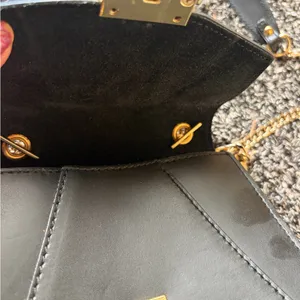 Elegant Black Leather Bag with Gold Accents thumbnail 6