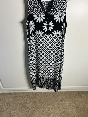 Chic sleeveless black and white dress with bold floral and geometric patterns. Lightweight and breathable for comfortable all-day wear. Collared neckline adds a polished touch and pockets. Easy to style for casual or dressy occasions. BIBA size medium thumbnail 5