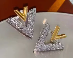 Stainless steel Double V Gold and silver earrings thumbnail 1