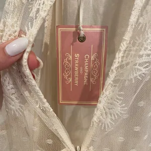 Champagne & Strawberry Tiered Maxi Dress With Crochet Trim & Floral Appliqué thumbnail 10