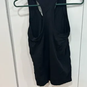 Small black Athleta racer back tank thumbnail 2