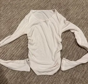 ALO Yoga Long-Sleeve Ribbed Top in Light Cream thumbnail 1