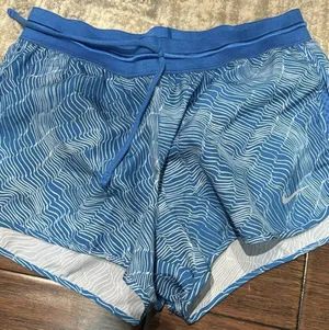 Nike Women's Dri-FIT Blue/ White "Run Fast" Wavy Abstract Print Running Shorts thumbnail 1