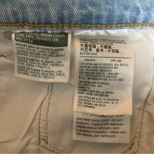 Levi’s 501 Cutoff Shorts Size 30 Light Wash Blue Denim Graphic Levi’s Stripe thumbnail 4