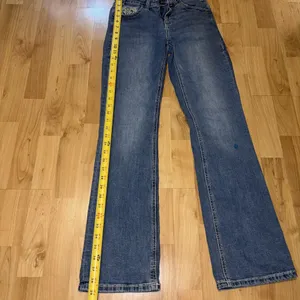 Rock and Roll Denim Cowgirl Women 26x32 distressed Mid Rise Bootcut Jeans thumbnail 3