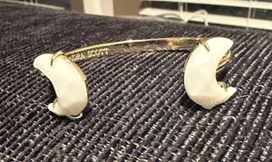 Kendra Scott Gold Cuff Bracelet with White Enamel Moon Ends thumbnail 1