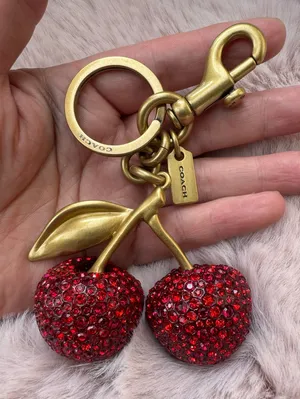 Coach cherry bag charm thumbnail 1