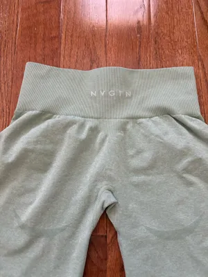 NVGTN Sage Green Contour Seamless Shorts M bike shorts lightly worn Our signature seamless material is now available in shorts! These shorts feature a conservative length that won’t be interrupted through movement along with a form flattering waistband that offers slight compression. This buttery soft and breathable material will not only feel weightless on your body, but will move with and not against you. Pair these with its matching seamless top or bra to complete the look. - Nylon and spandex - Fabric feels… lightweight, soft, stretchy - High waisted - Compressive waistband contour shaping thumbnail 6