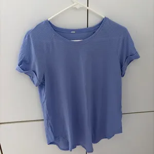 Blue Lululemon swiftly tech shirt with subtle horizontal ribbed texture #athletic #activewear thumbnail 1