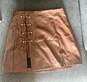 Faux leather brown skirt with gold accents thumbnail 1
