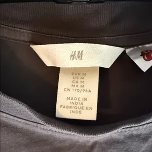 NWOT H&M Black band retro Tee with Pink & Yellow Rolling Stones Graphic medium thumbnail 2