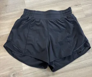 Lululemon Hotty Hot Short High-Rise Long 4" Women Size 6 Black thumbnail 1