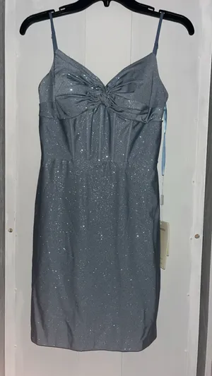 Stacees dusty blue, glittery, mid-length dress, with corset rib design, and knot design on chest, with bra padding built in. thumbnail 9