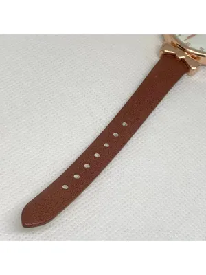 Women’s quartz analog watch gold tone 34mm round case brown leather band running thumbnail 4