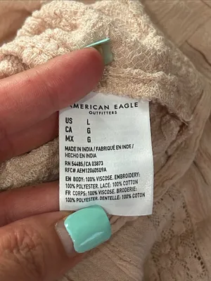 American Eagle smocked blouse. Open back with tie bow. Light pink. Size L thumbnail 9