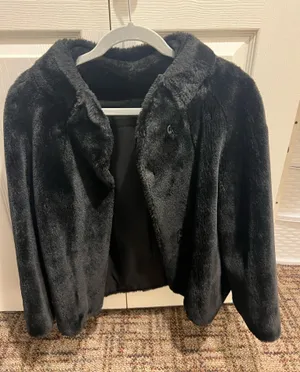 Elegant black faux fur jacket. Perfect for a chic look. thumbnail 1