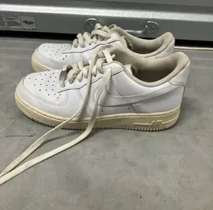 White leather Nike Air Force 1s thumbnail 1