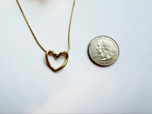 Gold twisted heart necklace minimalist stackable thumbnail 2