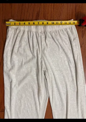Nicole Miller Cream Embossed Paw pattern lounge pants - Size Medium. Super cute & soft & gently used & very good condition. Measurements approximately 15” waste not fully stretched out from elastic waste band x 39” long x 11” rise. Non-smoking home m. Priced to sell at as is condition. Don’t like my price make reasonable offer! thumbnail 5