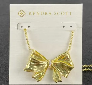🎀 Kendra Scott x LoveShackFancy Large Gold Bow Statement Necklace thumbnail 1