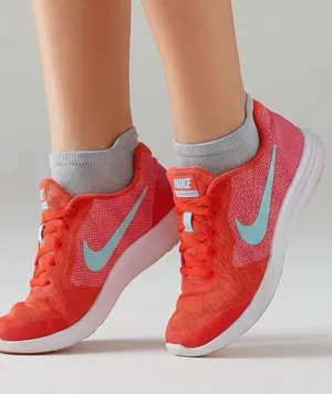 Nike Women's Coral-Red Running Sneakers with Aqua Swoosh Sz 8.5 (7Y) thumbnail 1