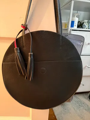 Anthropologie Round Black Leather Shoulder Bag with Tassel Accent thumbnail 1