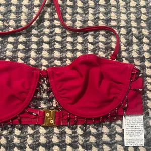 MUSÉRA red beaded bikini topwith gold buckle detail on the back #beaded #buckle Size small but fits like an XS thumbnail 2