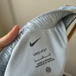 Nike‎ Dri Fit Running Shorts Light Blue Dolphin Hem Athletic Womens Size L thumbnail 6