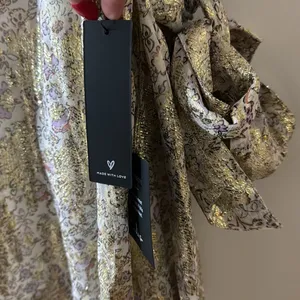 Lulu’s White and Gold Floral Print Tie-Back Midi Dress thumbnail 4