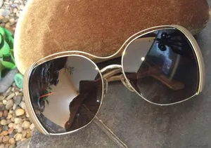Miu Miu Sunglasses thumbnail 1